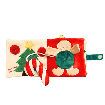 Christmas-themed soft dog book with gingerbread man, candy cane, and tree on a white background