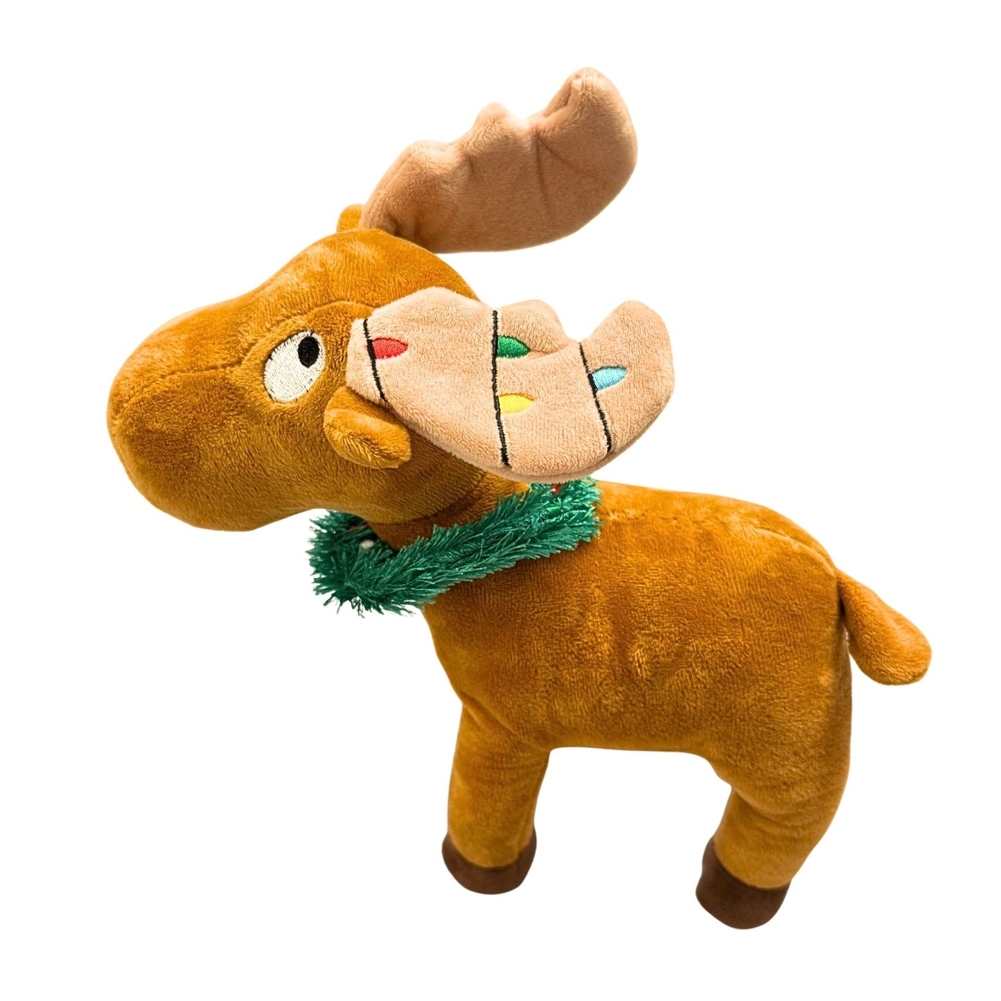 Plush moose toy with a green scarf on a white background