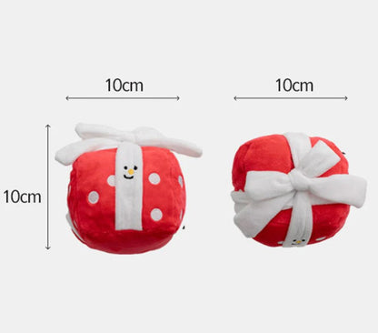 Two small red plush toys with white bows and measurements on a white background